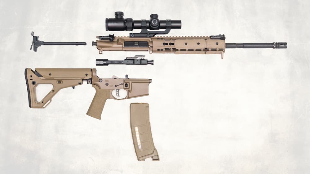 Flat lay image of a modular rifle breakdown, used as a visual guide for AR-15 cleaning and internal component inspection.